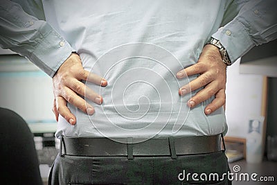 Men, pain at lower back Stock Photo