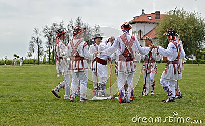 Men performing traditional romanian Calusari dance Editorial Stock Photo