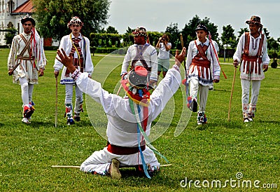 Men performing traditional romanian Calusari dance Editorial Stock Photo