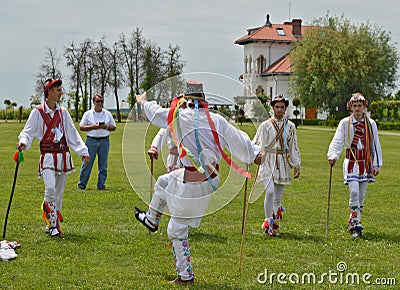 Men performing traditional romanian Calusari dance Editorial Stock Photo