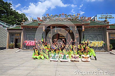 Men performs the Dragon dancing to practise prepare for lunar New Year at a Pagoda Editorial Stock Photo
