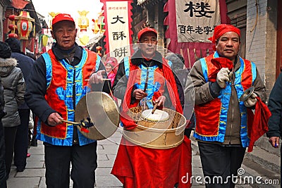 Men playing drum gong Chinese folk entertainment Editorial Stock Photo