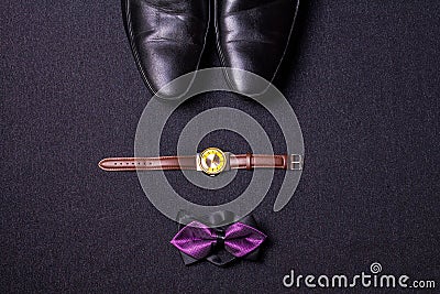 Men`s accessories on black background tie wallet watch strap sho Stock Photo