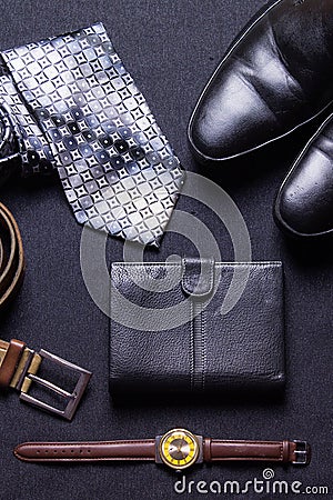 Men`s accessories on black background tie wallet watch strap sho Stock Photo