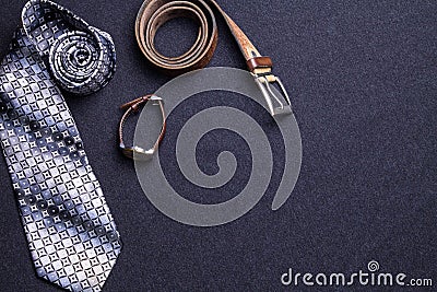 Men`s accessories on black background tie wallet watch strap sho Stock Photo