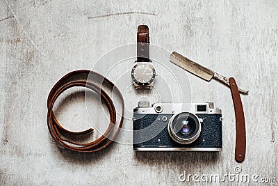 Men's Accessories , top view on a wooden background Retro camera watch razor Stock Photo