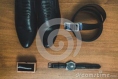 Men`s accessories: watch, tie, belt, shoes top view Stock Photo