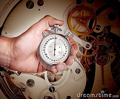 Mens hand with timer and watch mechanism Stock Photo