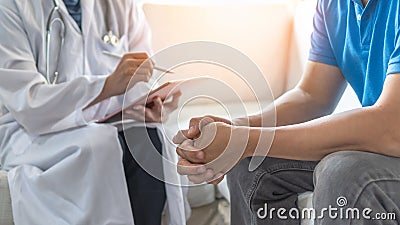 Men`s health exam with doctor or psychiatrist working with patient having consultation on diagnostic examination on male disease Stock Photo