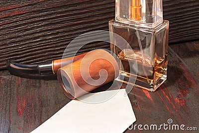 Men`s perfume on the mahogany table. Stock Photo