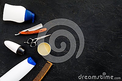 Men`s set for everyday body, facial and hair care. Shampoo, gel, tools for brushing, sciccors, comb on black background Stock Photo