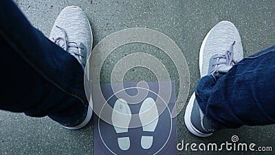 Men's shoes with jeans on the floor with the footprints on it Stock Photo