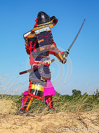 Men in samurai armour with sword. Stock Photo