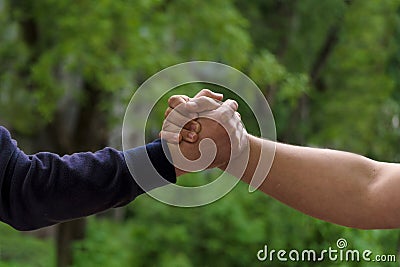 Men shake hands. Businessmen handshaking after good deal. Concept of successful business partnership meeting . Holding hands. Stock Photo