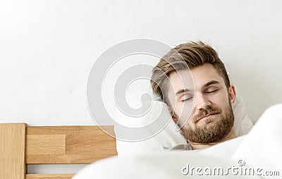 Men sleep on bed Stock Photo