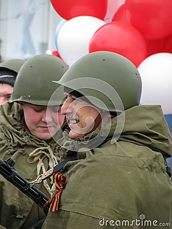 Men in soldier`s uniform with balloons Editorial Stock Photo