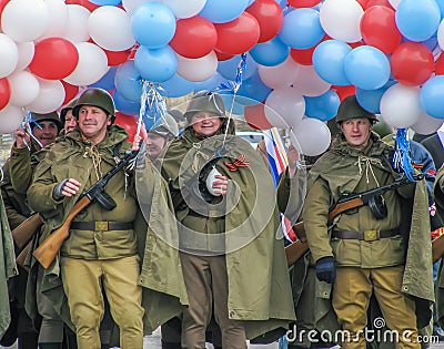 Men in soldier`s uniform with balloons Editorial Stock Photo