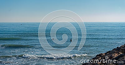Men surfing in the Mediterranean Sea Editorial Stock Photo