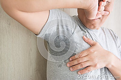 Men with sweaty armpits Stock Photo