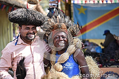 Men in traditional African Tribal dress, enjoying the fair Editorial Stock Photo