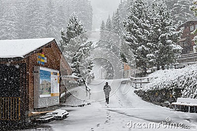 Men wearing black clothes walking in the snow Editorial Stock Photo