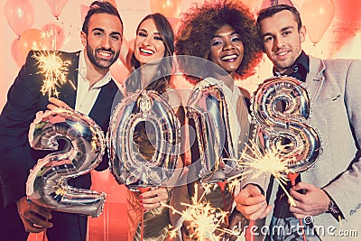 Men and women celebrating the new year 2018 Stock Photo