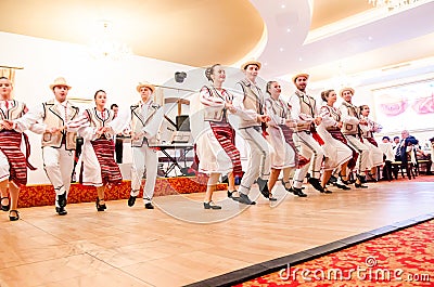 Men and women dancers performing Romanian folk dances Editorial Stock Photo