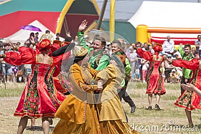 Men and women in national costumes dance traditional folk dances Editorial Stock Photo