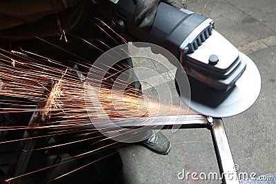 Men at work grinding steel Stock Photo