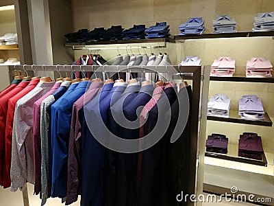 Clothing for men in a shop - colorful blazers Stock Photo