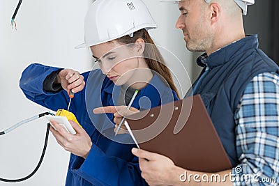 she mending wires Stock Photo