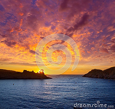 Menorca sunset in Cala Morell at Ses torretes beach Stock Photo