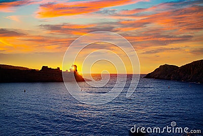 Menorca sunset in Cala Morell at Ses torretes beach Stock Photo