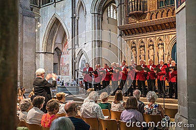 Mens choir performing in a cathedral Editorial Stock Photo