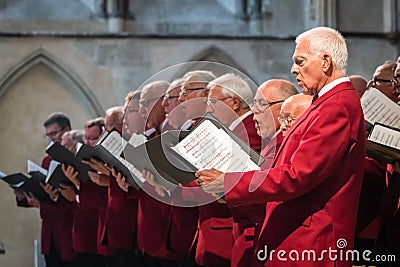 Mens choir performing in a cathedral Editorial Stock Photo