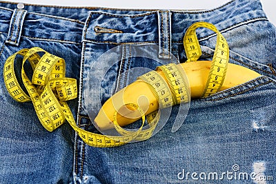 Mens denim pants with banana imitating male genitals, close up Stock Photo