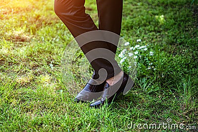 Mens feet in brown shoes close up Stock Photo