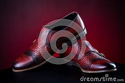 Mens leather burgundy shoes on red background Stock Photo