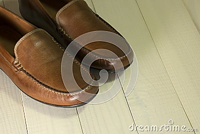 Mens moccasin shoes on a wooden background Stock Photo