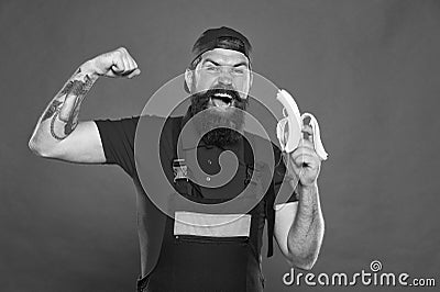 Mens power and health. erect banana as concept of treating impotence. healthy break concept. brutal strong male in cap Stock Photo