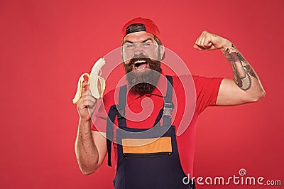 Mens power and health. erect banana as concept of treating impotence. healthy break concept. brutal strong male in cap Stock Photo
