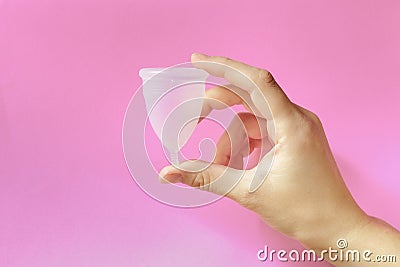 Menstrual cup on pink background, feminine hygiene Stock Photo