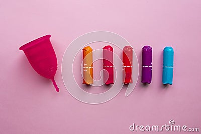 Menstrual cup and tampons. Reusable menstrual cup is an alternative to disposable tampons Stock Photo