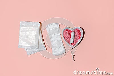 Menstrual tampon medical pad on pink background, top view, hard shadow, copyspace. Concept of choosing between protection Stock Photo