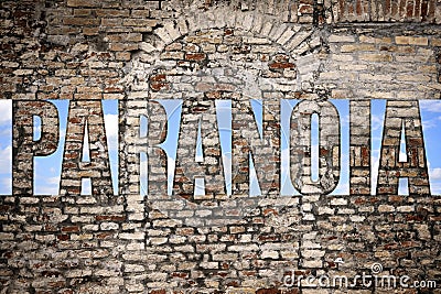 Mental disorder. View on blue sky through word Paranoia in brick wall Stock Photo