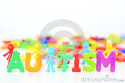 Mental health disorder, autism word with colored toys figurine on white background Stock Photo