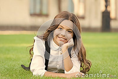 Mental wellness. Girl school uniform enjoy relax. Importance of relaxation. Little schoolgirl. Relax at school yard. Kid Stock Photo