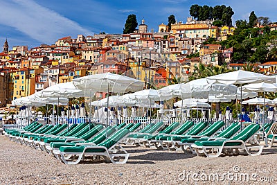 Menton. Antique multi-colored facades of medieval houses on the shore of the bay. Stock Photo