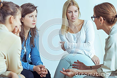 Mentor speaking to businesswomen about career during seminar with training Stock Photo