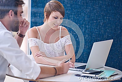 Mentorship between male tutor and female student using modern laptop Stock Photo